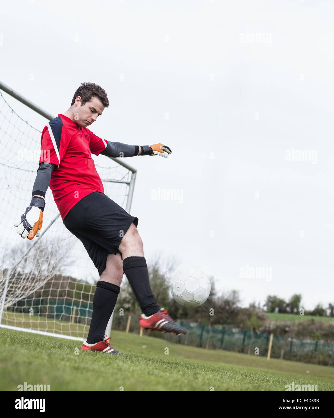 Goalkeeper Rushing Out Kick ball away hi-res stock photography and images - Alamy