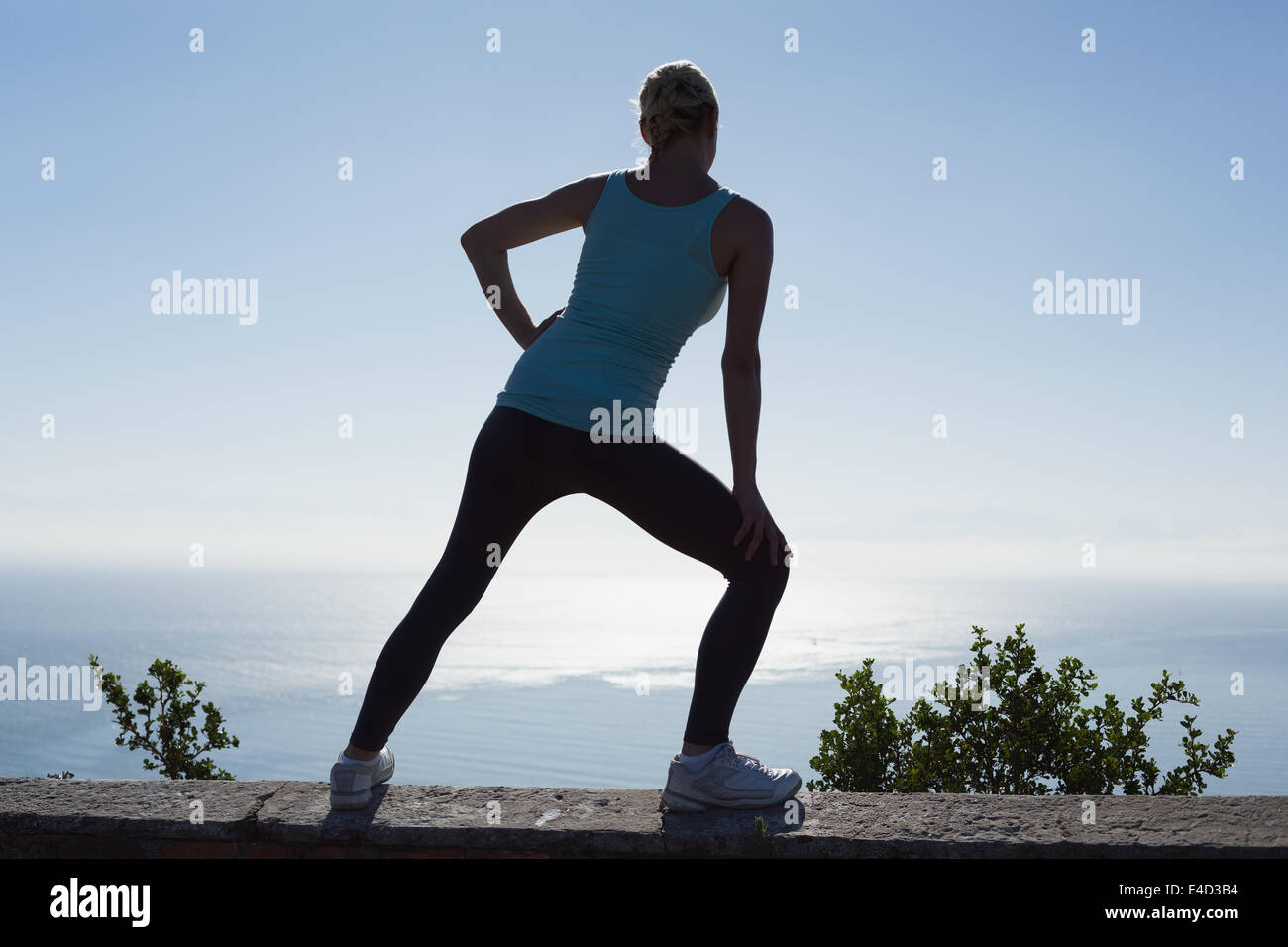 Athletic woman stretching legs hi-res stock photography and images - Alamy