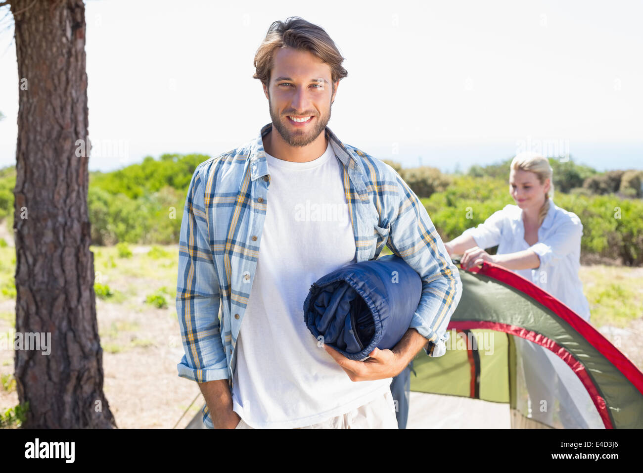Attractive man smiling hi-res stock photography and images - Alamy