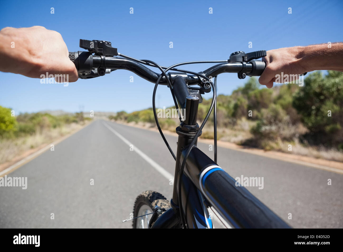 Cyclist hitting the open road Stock Photo