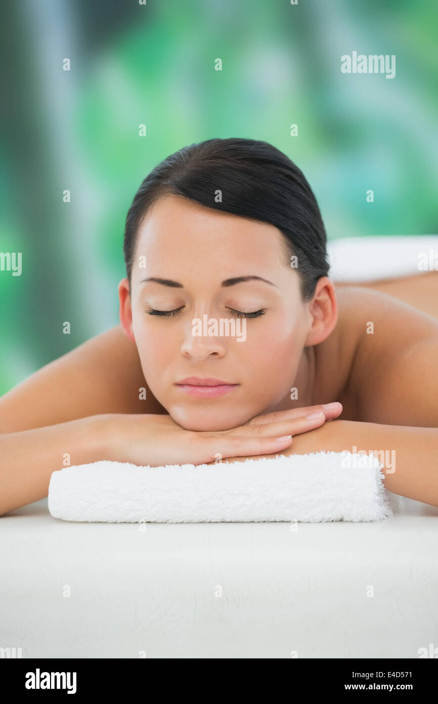 Beautiful brunette relaxing on massage table Stock Photo