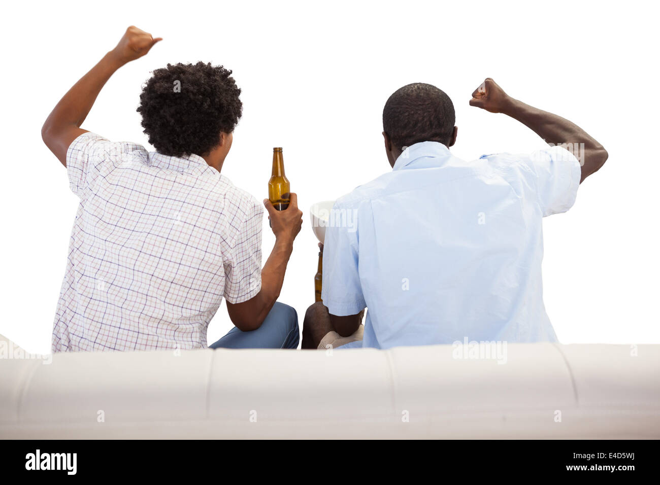 Cheering sports fans sitting on the couch with beers Stock Photo Alamy