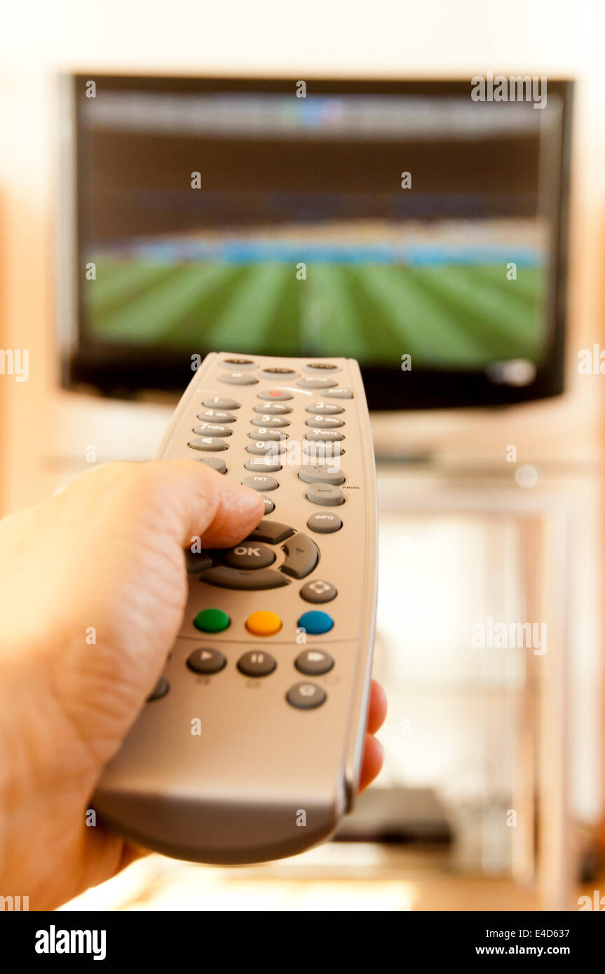 watching football in tv Stock Photo