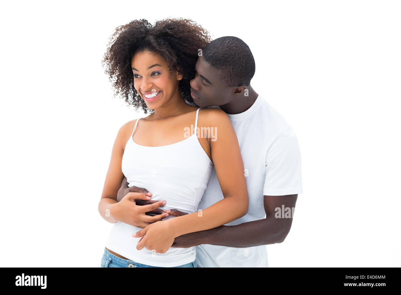 Casual couple embracing in matching white tops Stock Photo
