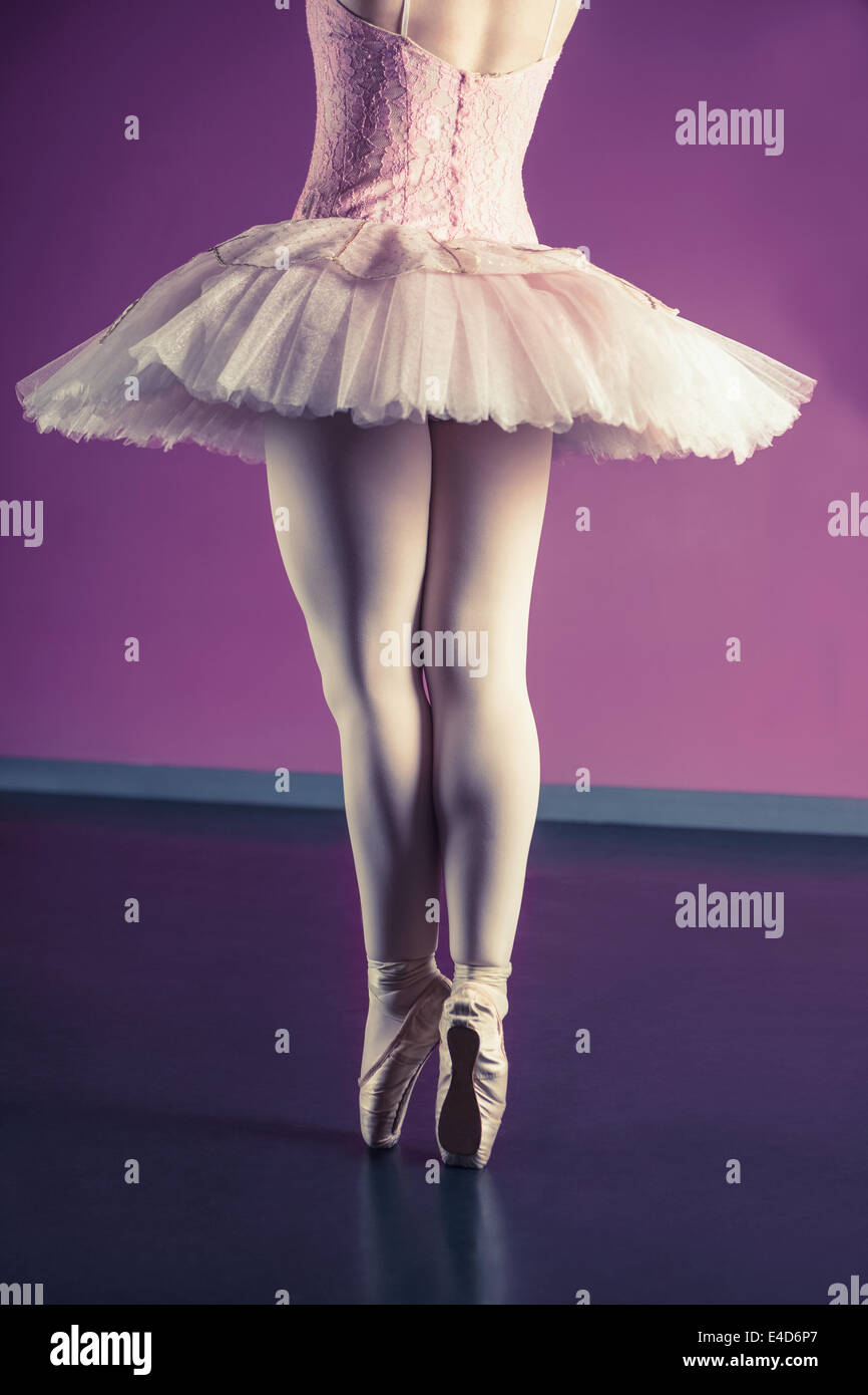 Graceful ballerina standing en pointe Stock Photo
