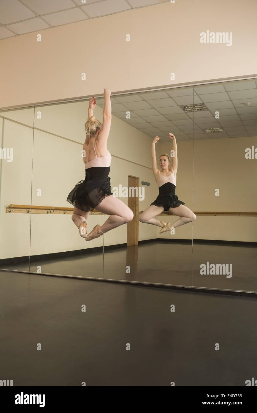 Beautiful ballerina dancing in front of mirror Stock Photo Alamy