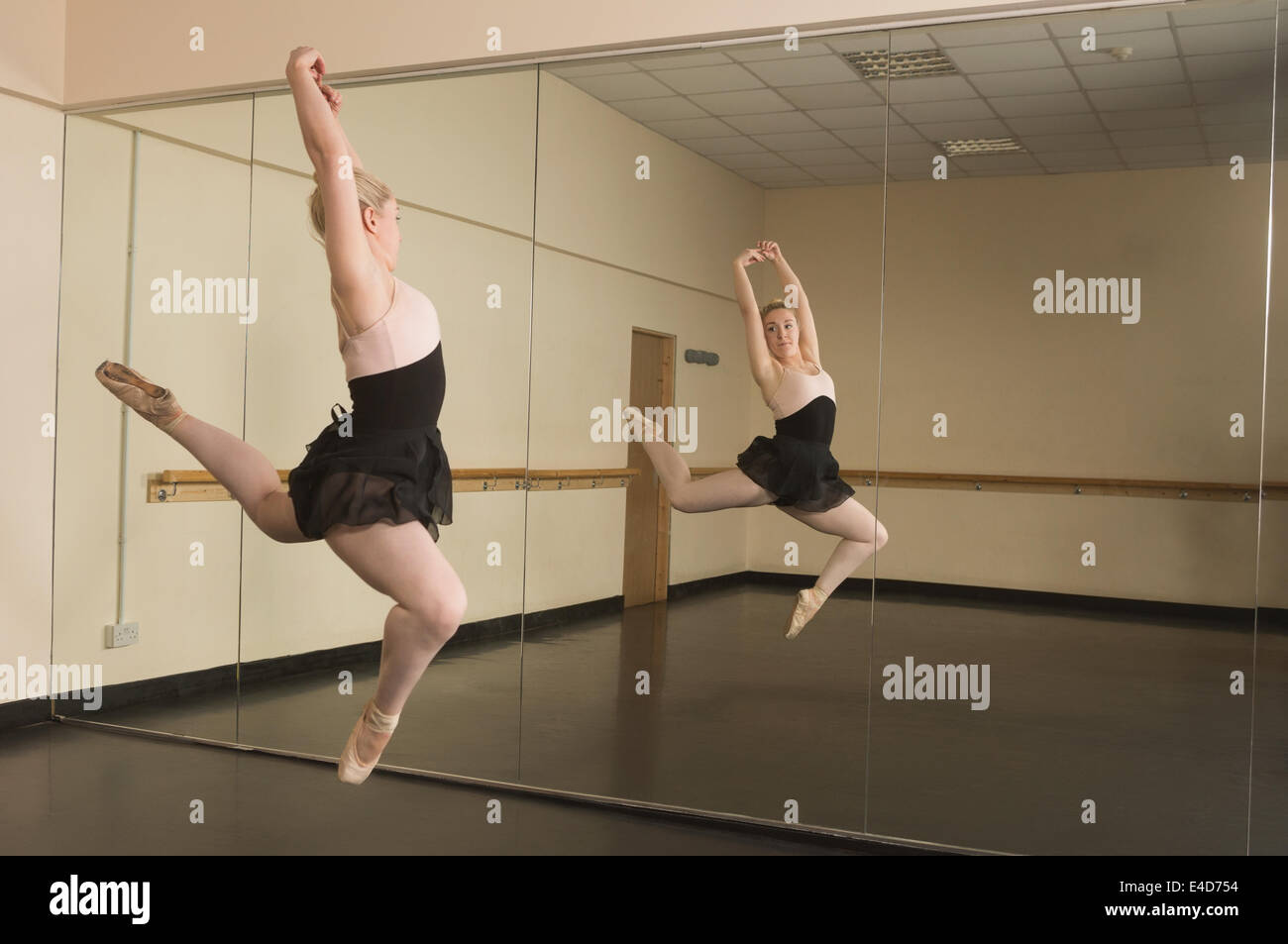 Beautiful ballerina dancing in front of mirror Stock Photo Alamy