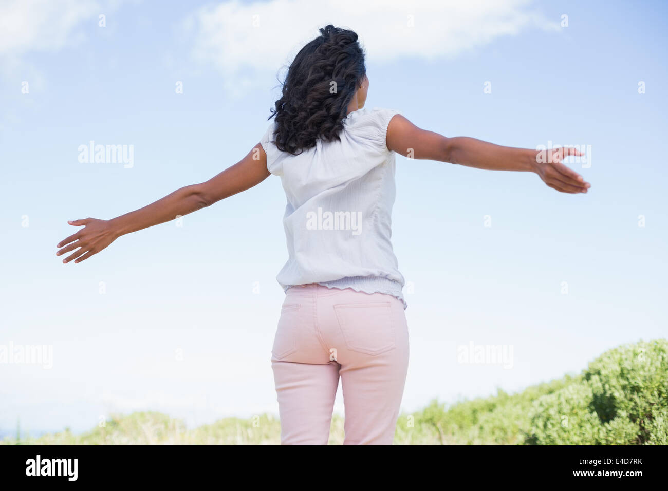 Black woman standing arms out hi-res stock photography and images - Alamy