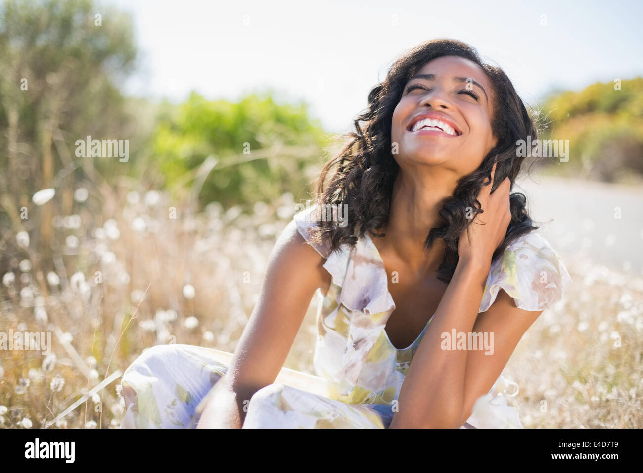 Happy black woman sitting on hi-res stock photography and images - Alamy