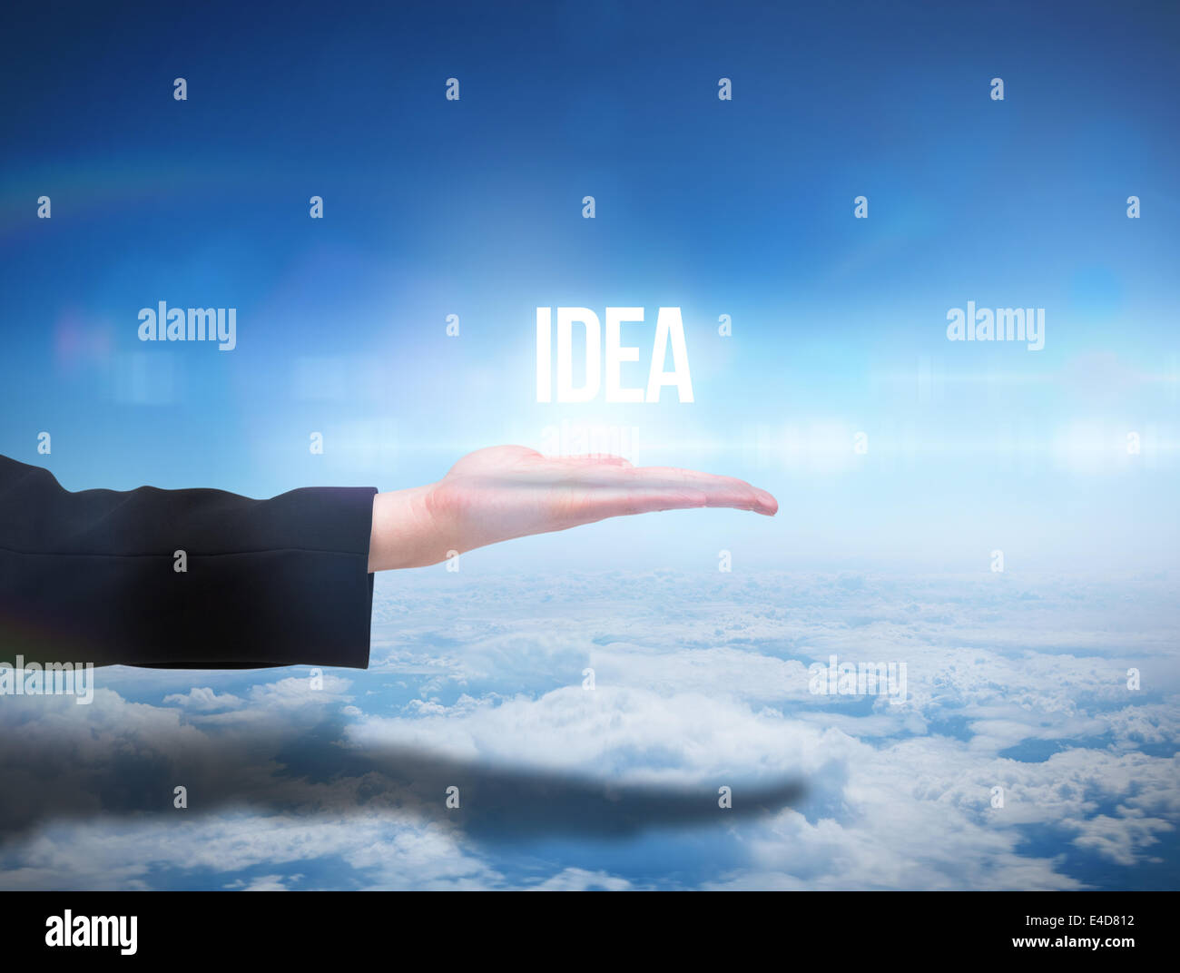 Businesswomans hand presenting the word idea Stock Photo
