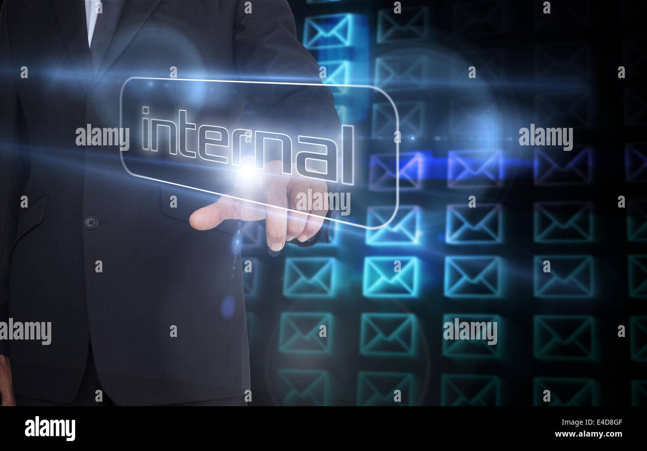 Businessman pointing to word internal Stock Photo