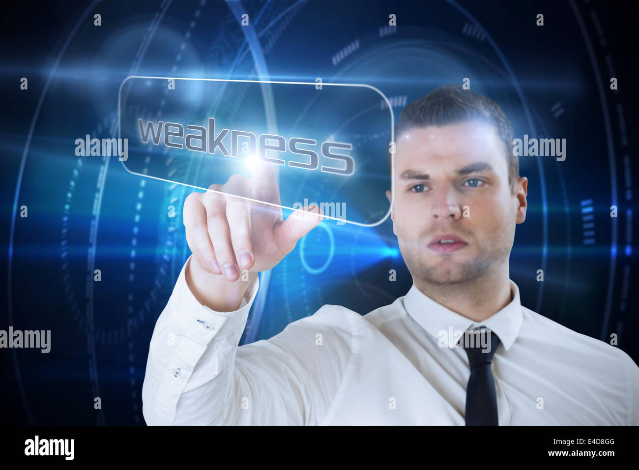 Businessman pointing to word weakness Stock Photo