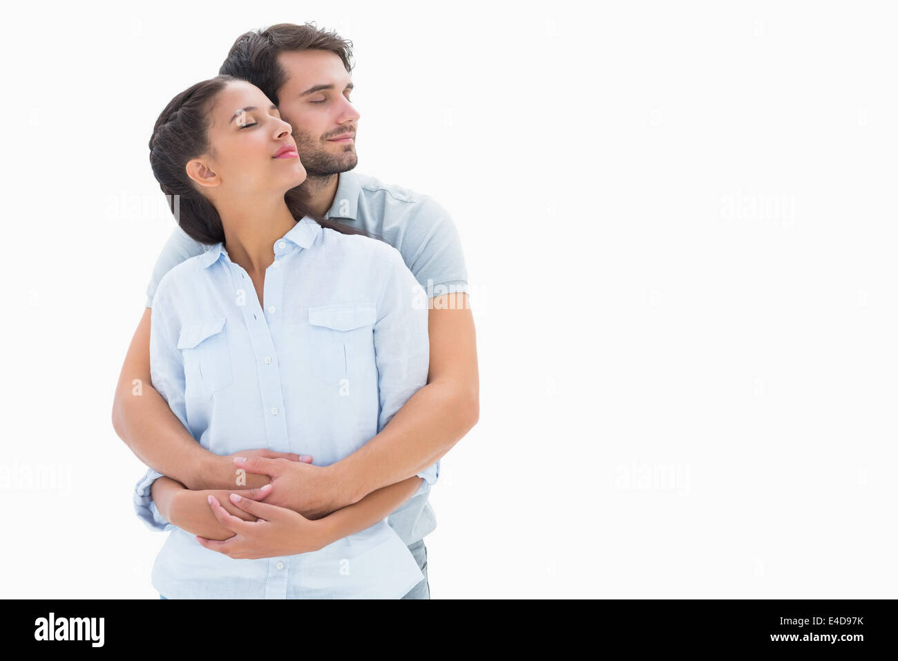 Cute couple embracing with eyes closed Stock Photo