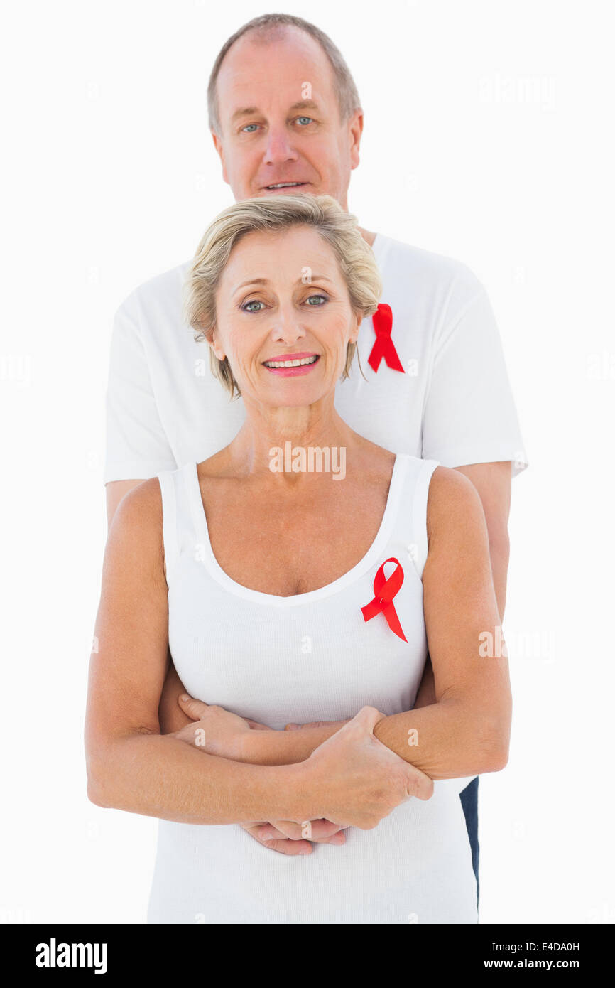 Mature couple supporting aids awareness together Stock Photo