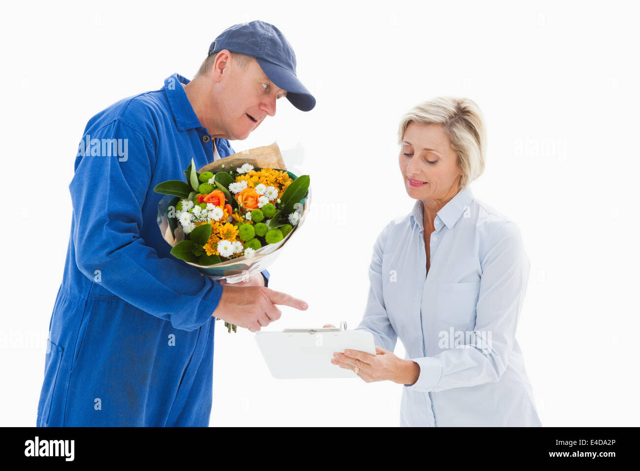 Happy flower delivery man with customer Stock Photo
