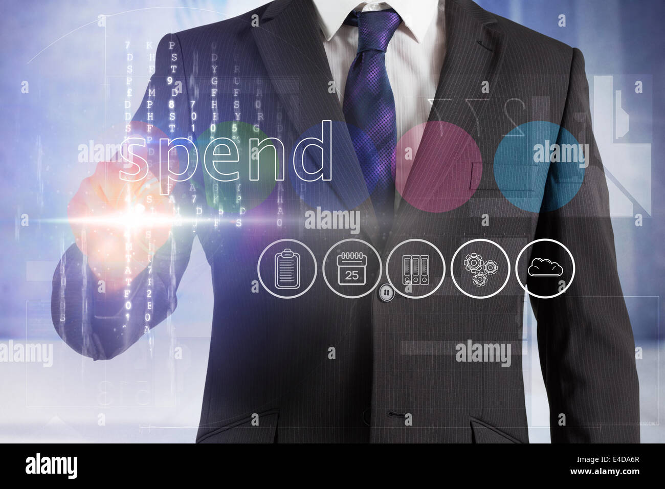Businessman touching the word spend on interface Stock Photo