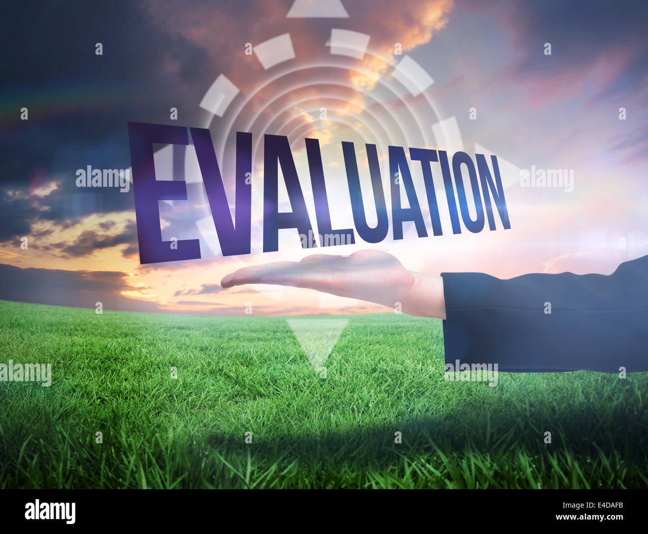 Businesswomans hand presenting the word evaluation Stock Photo
