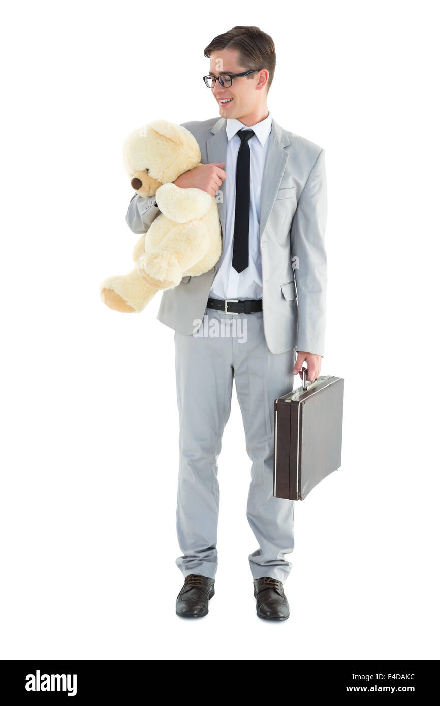 Handsome businessman holding briefcase and teddy Stock Photo