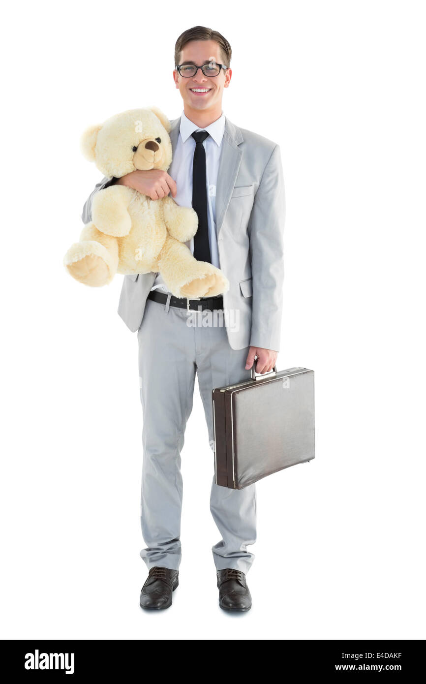 Handsome businessman holding briefcase and teddy Stock Photo