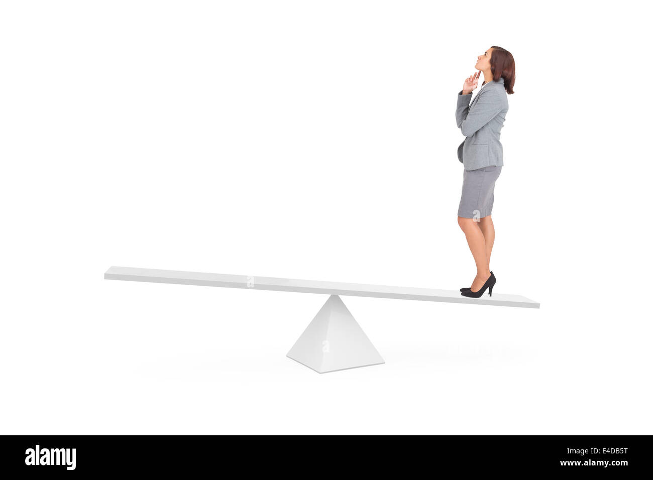 Composite image of focused businesswoman on scales Stock Photo