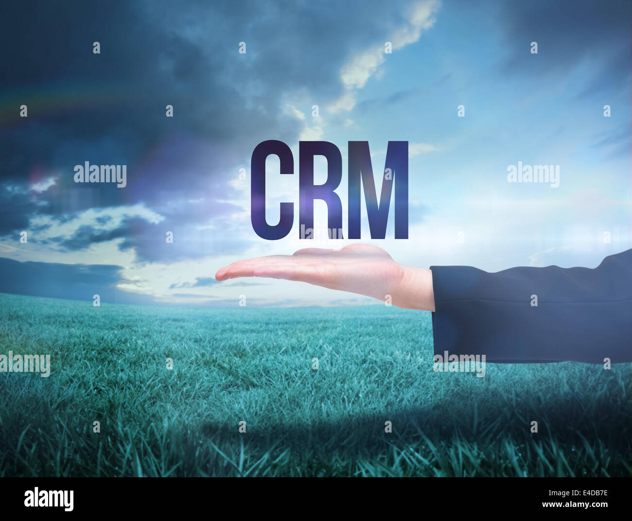 Businesswomans hand presenting the word crm Stock Photo