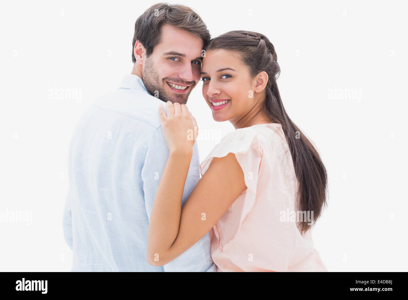 Attractive young couple smiling at camera Stock Photo - Alamy