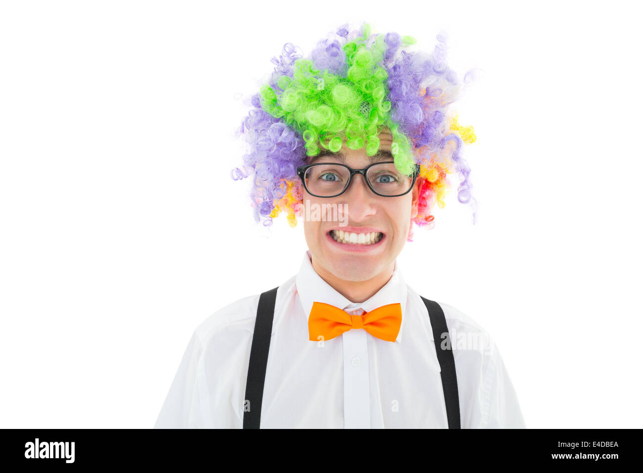 Geeky hipster wearing a rainbow wig Stock Photo