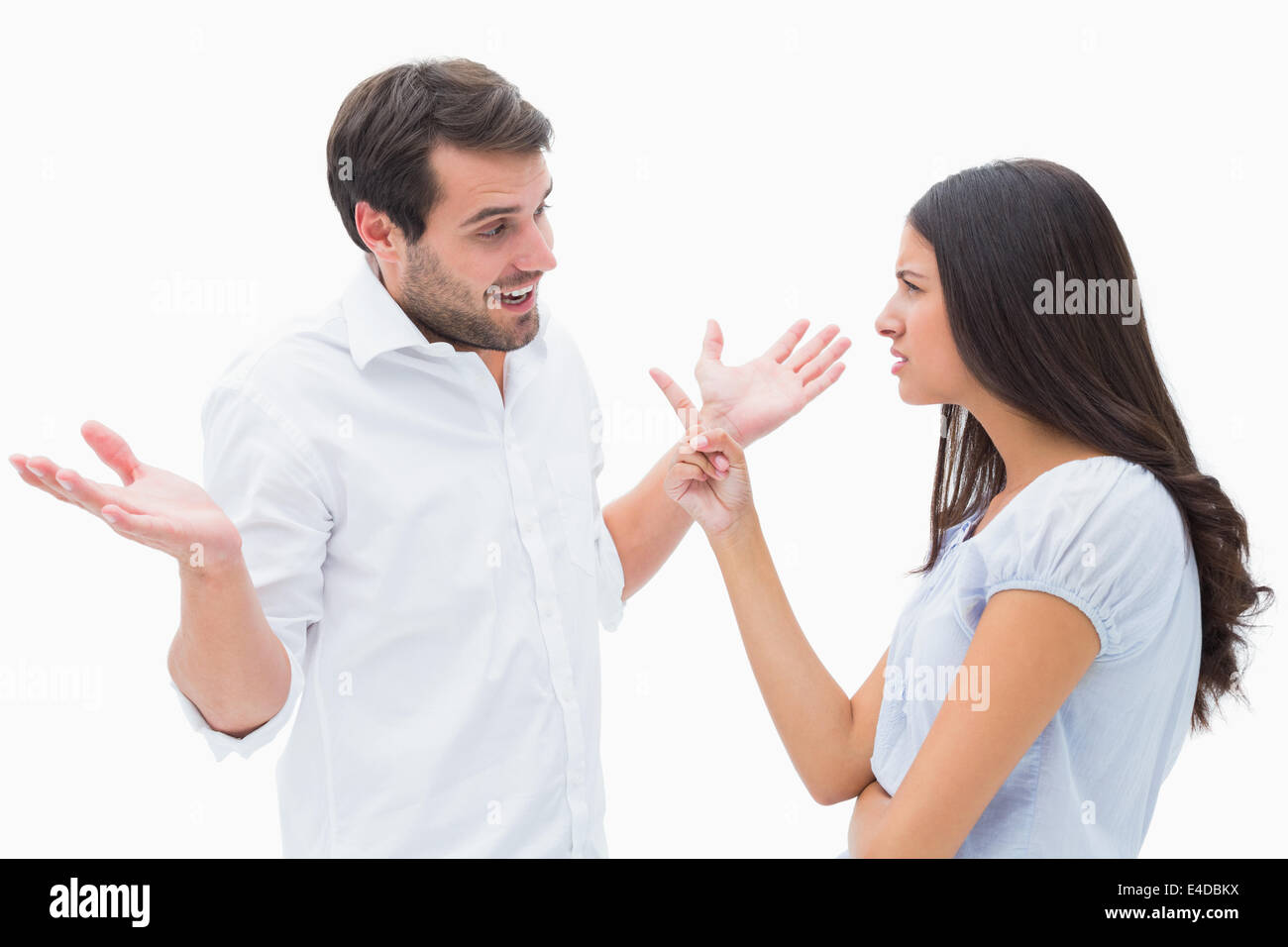 Angry brunette accusing her boyfriend Stock Photo