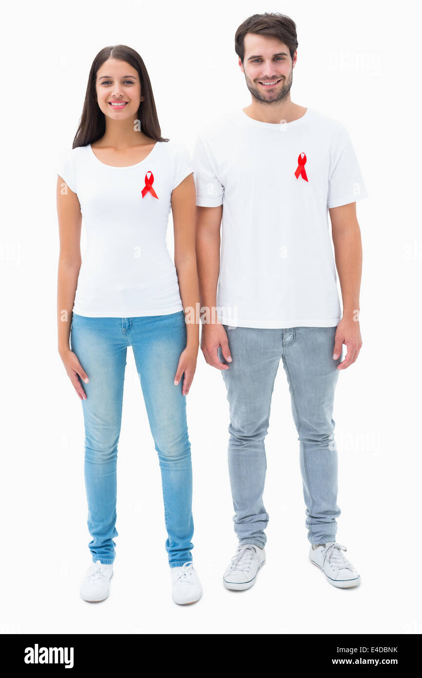 Attractive young couple wearing aids awareness ribbons Stock Photo