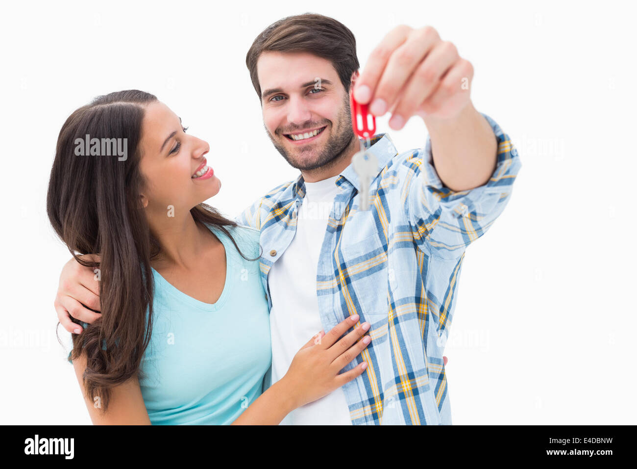 Happy young couple showing new house key Stock Photo - Alamy
