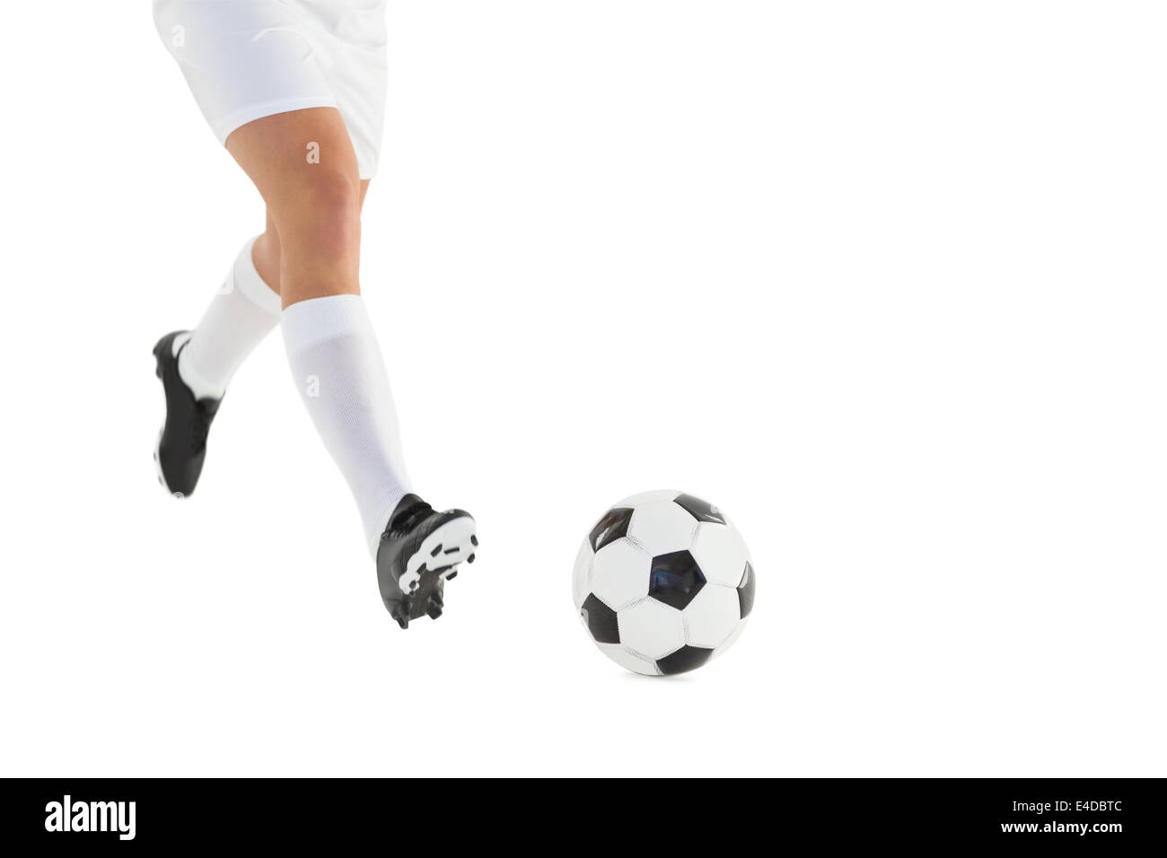 Football player kicking the ball Stock Photo Alamy