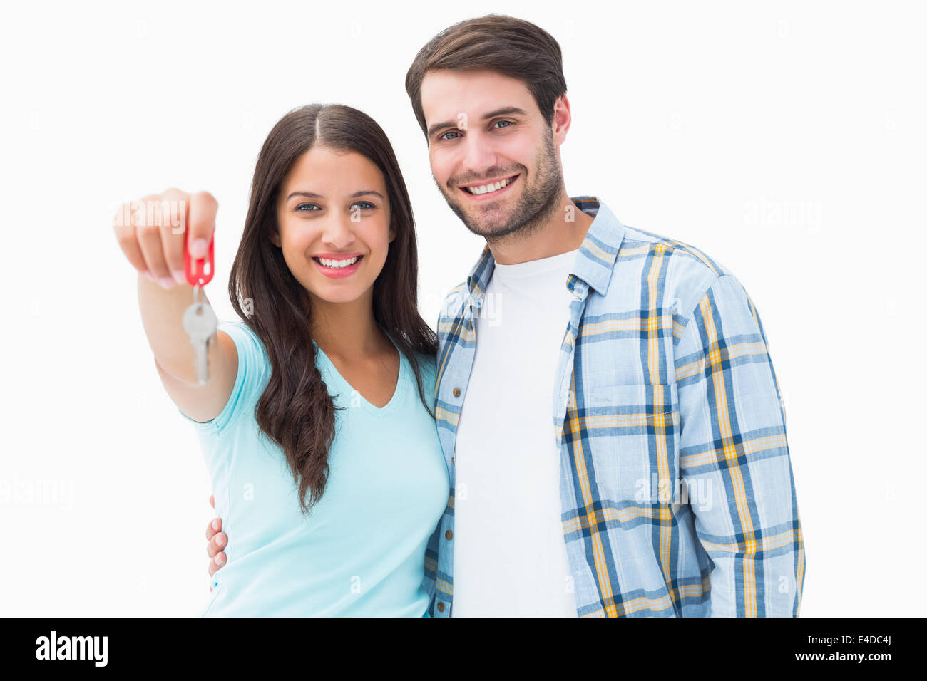 Happy young couple showing new house key Stock Photo - Alamy