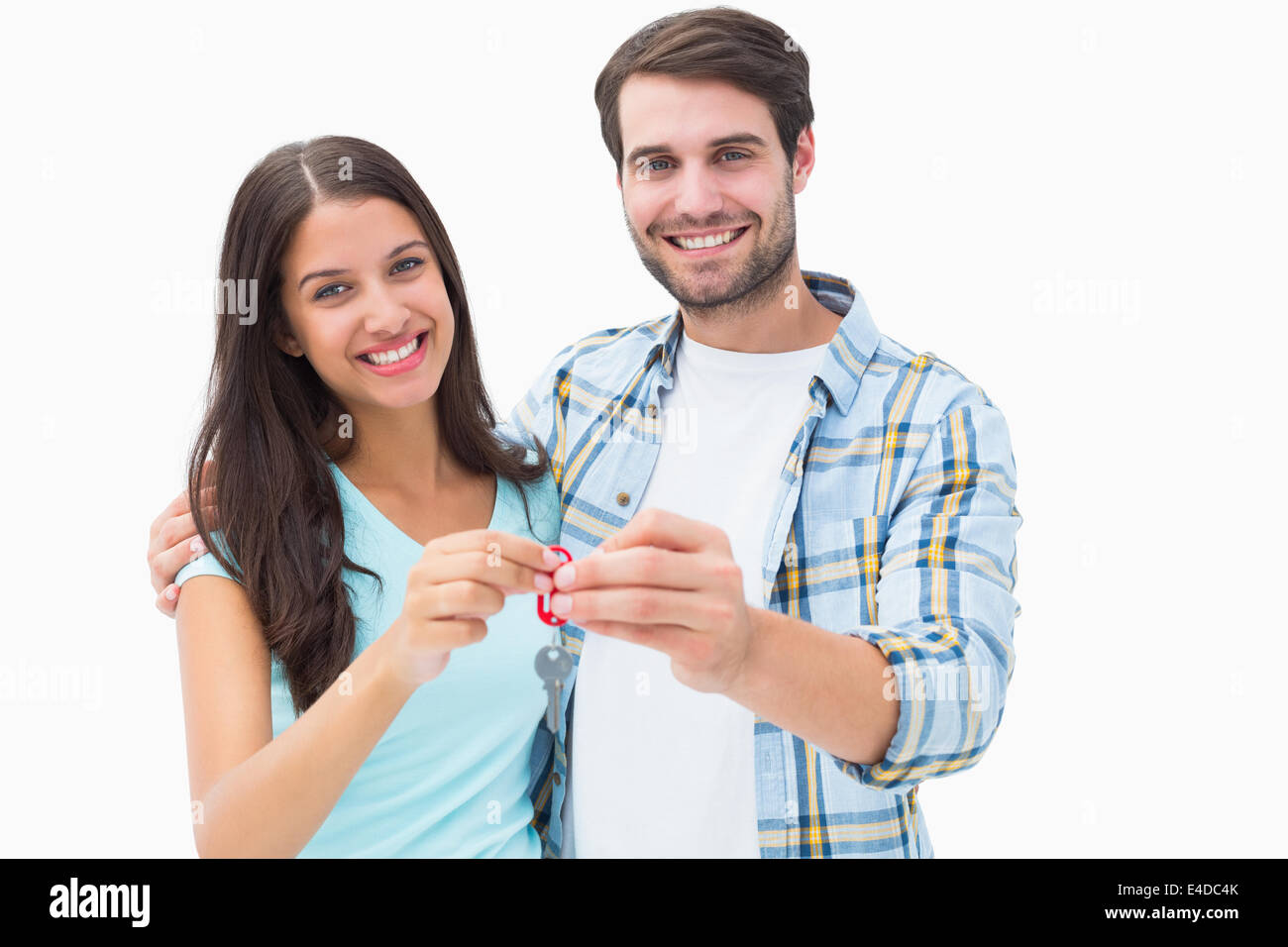 Happy young couple showing new house key Stock Photo - Alamy