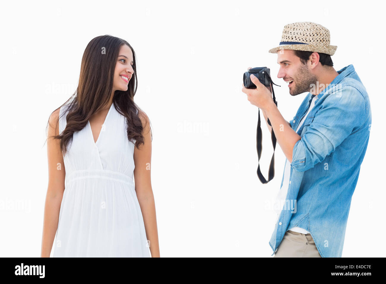 Handsome hipster taking a photo of pretty girlfriend Stock Photo