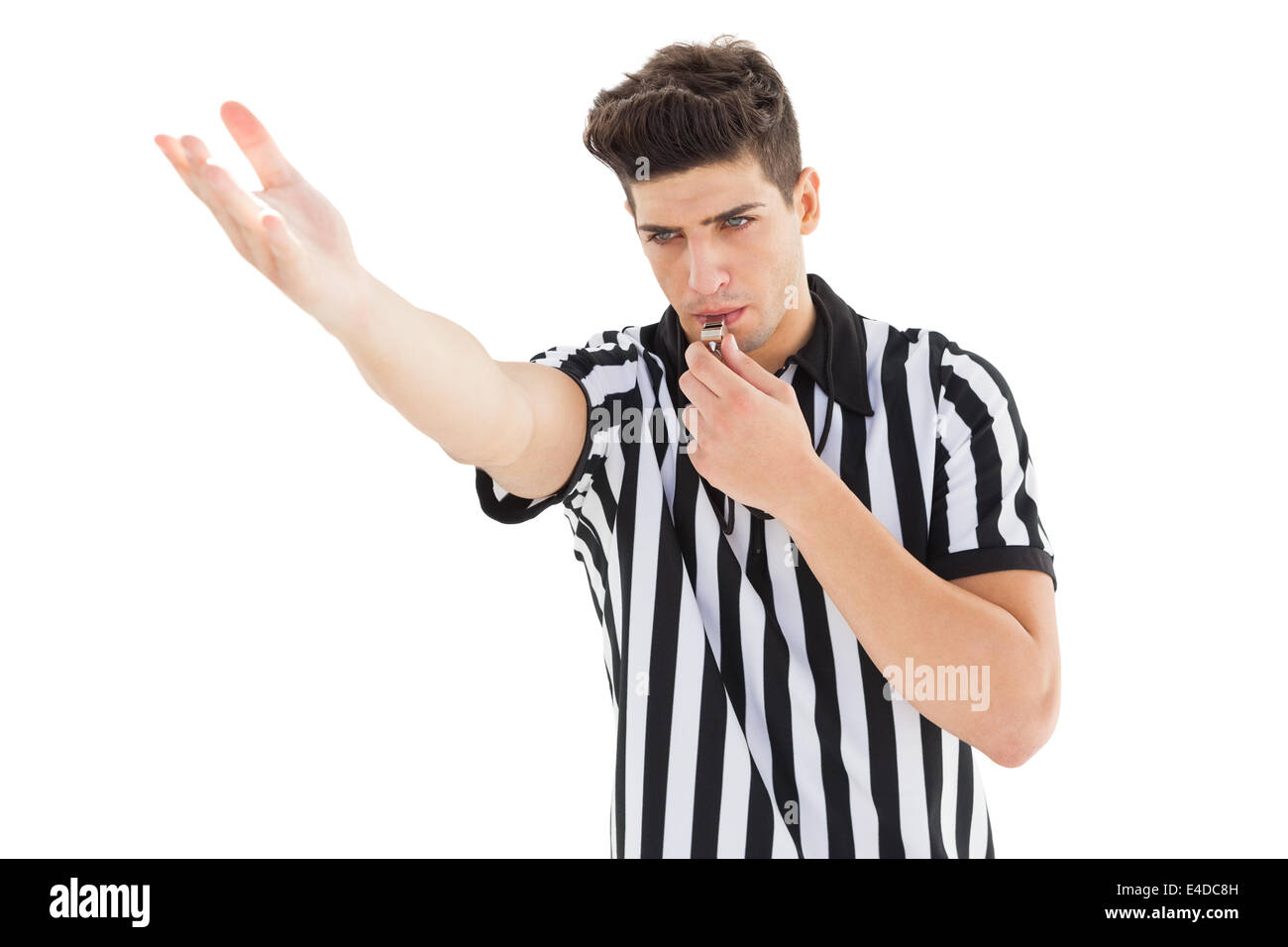 Stern referee blowing his whistle Stock Photo Alamy
