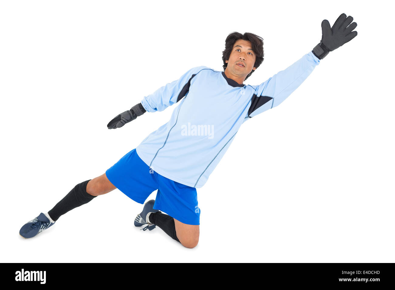 Goalkeeper in blue making a save Stock Photo