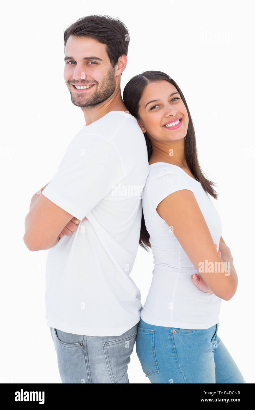 Happy couple smiling at camera Stock Photo - Alamy