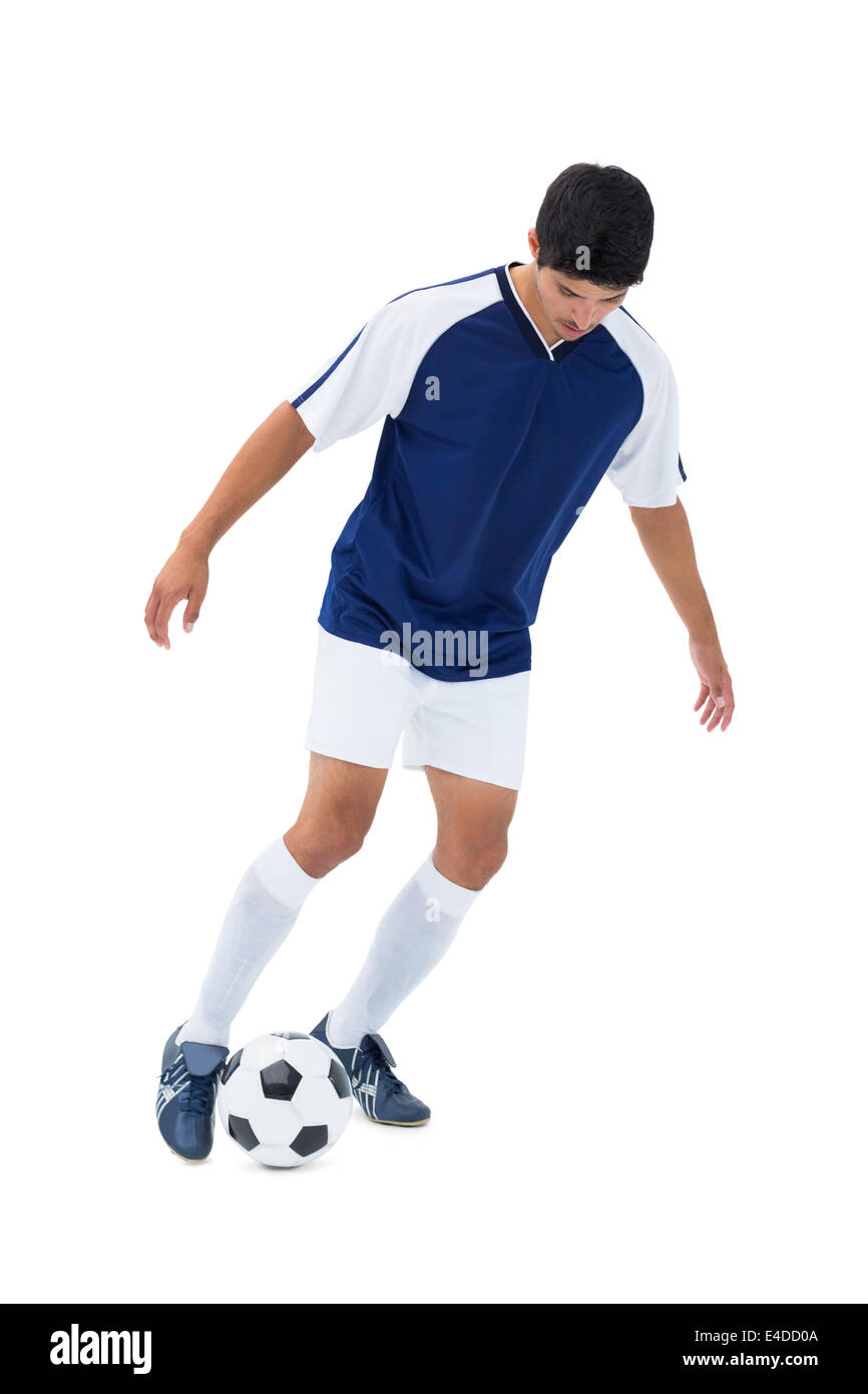 Football player kicking the ball Stock Photo Alamy