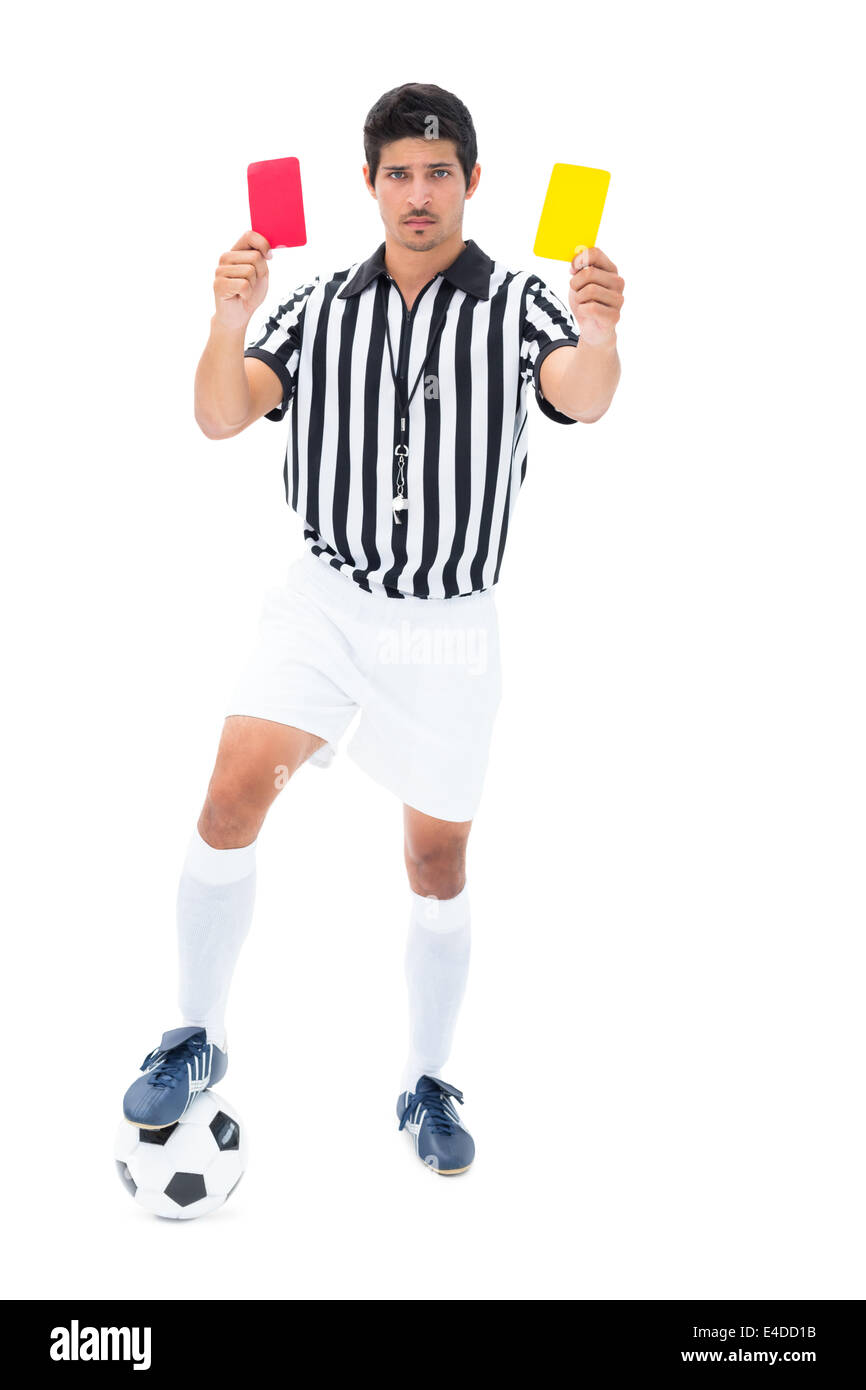 Serious referee showing red and yellow card Stock Photo
