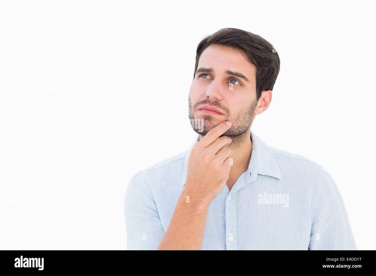 Serious thinking man looking up Stock Photo Alamy