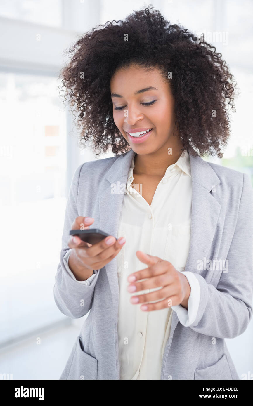 Happy african woman texting in hi-res stock photography and images - Alamy