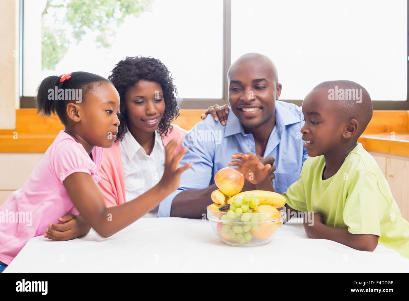 Happy family having fruit together Stock Photo