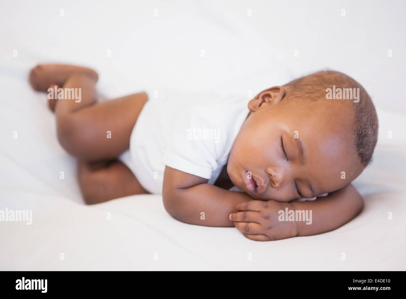 Baby boy sleeping peacefully on couch Stock Photo