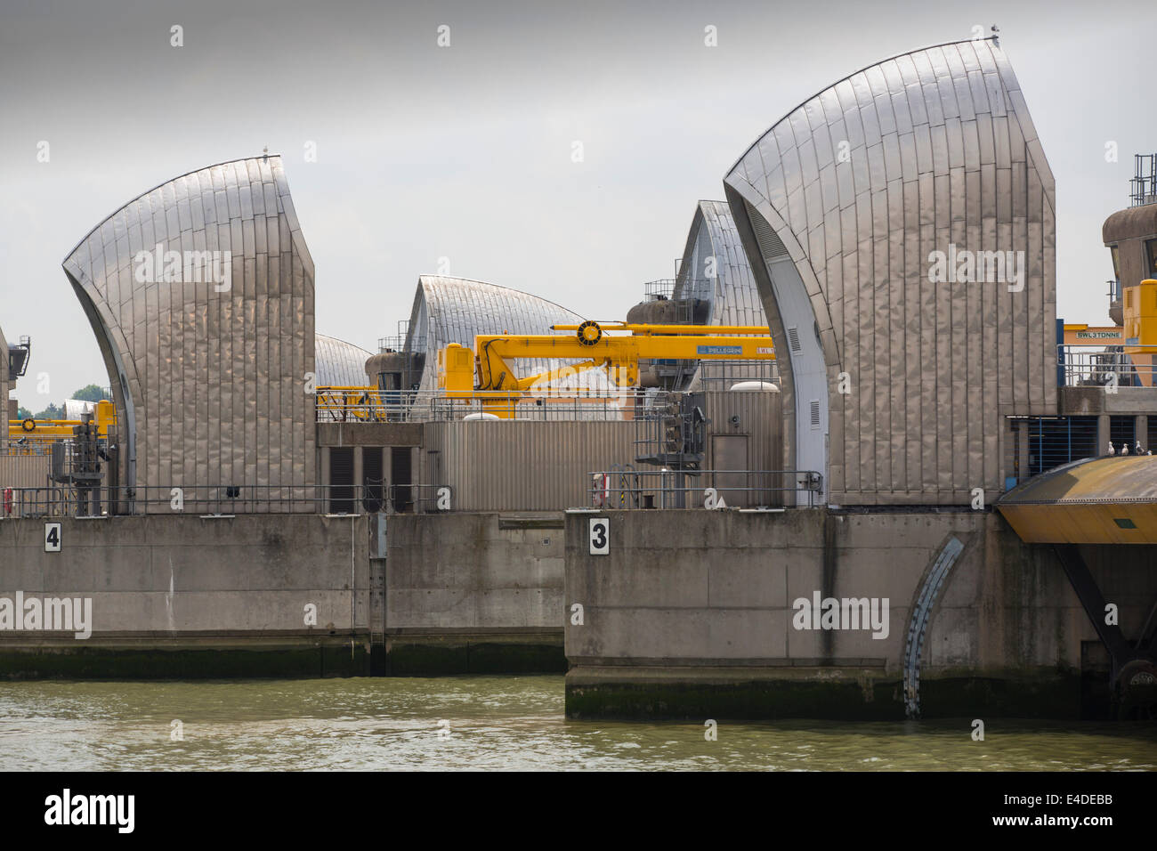 The Thames barrier on the River Thames in London. It was constructed to protect the capital city from storm surge flooding. Recent predictions show it will probably be redundant in around twenty years due to increased stormy weather and sea level rise driven by climate change. Stock Photo