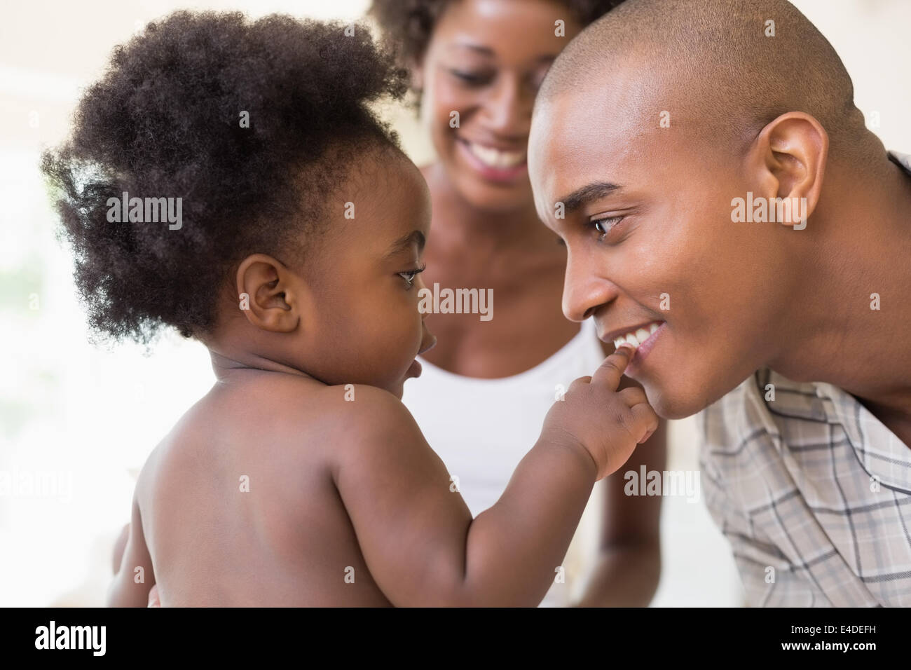 Happy parents with their baby girl Stock Photo