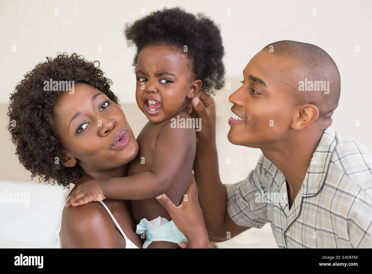 Happy parents with baby girl Stock Photo