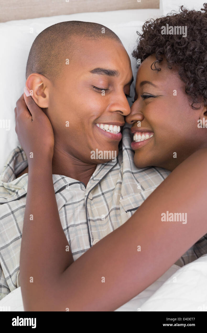 Happy couple cuddling african american hi-res stock photography and ...