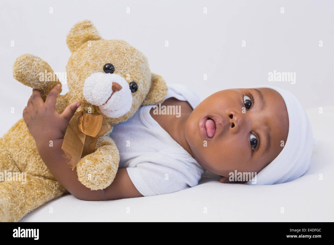 Adorable baby boy with teddy Stock Photo