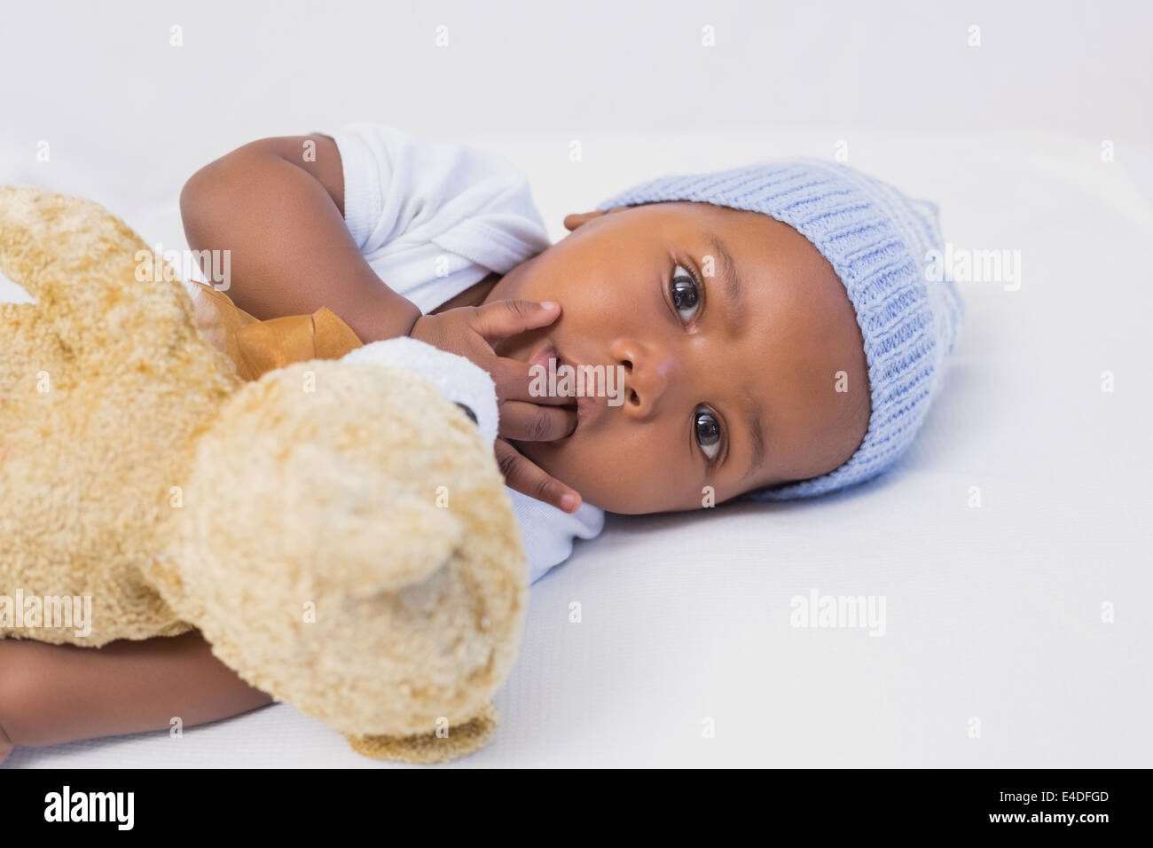 Adorable baby boy with teddy Stock Photo