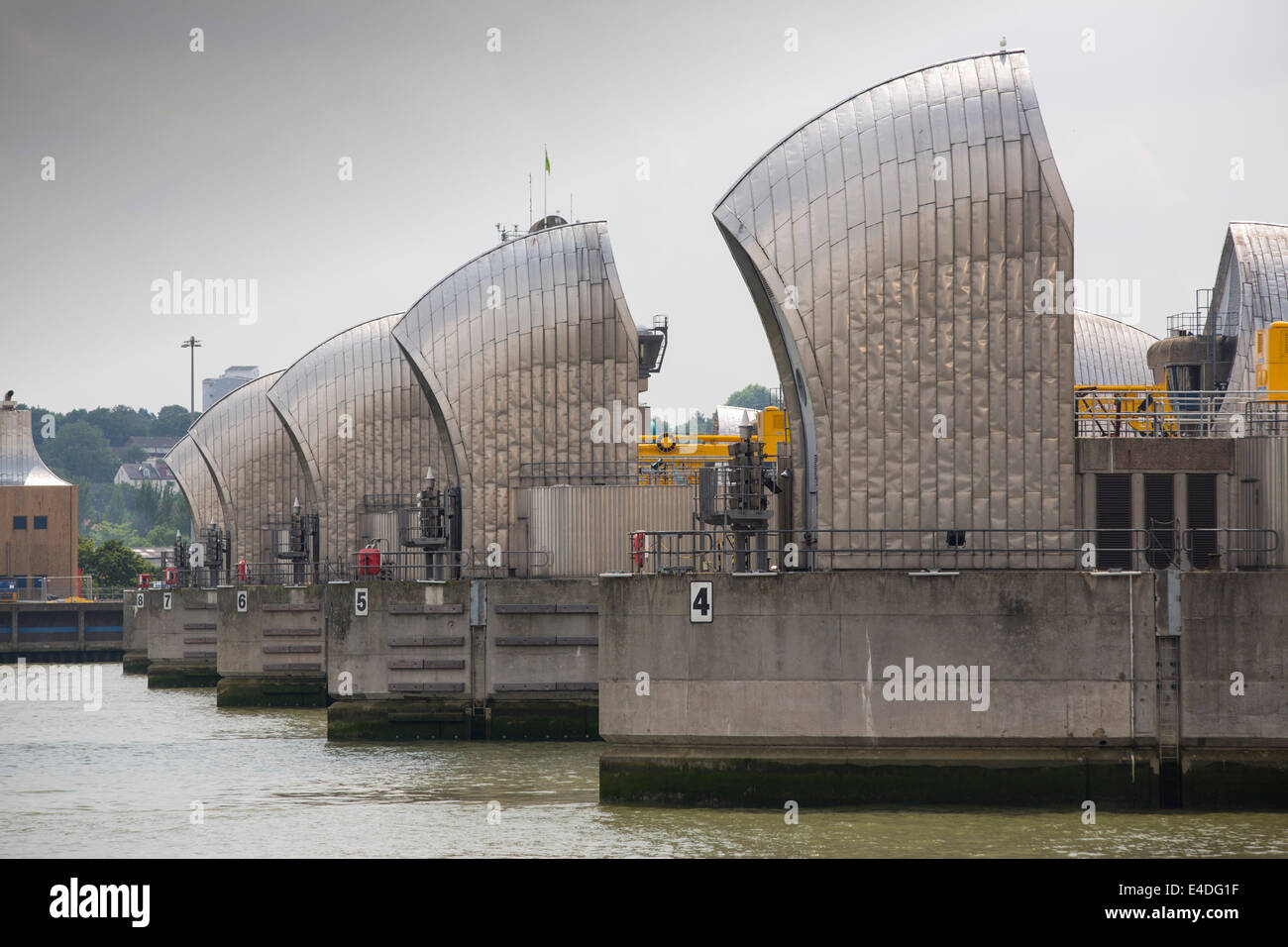 The Thames barrier on the River Thames in London. It was constructed to protect the capital city from storm surge flooding. Recent predictions show it will probably be redundant in around twenty years due to increased stormy weather and sea level rise driven by climate change. Stock Photo